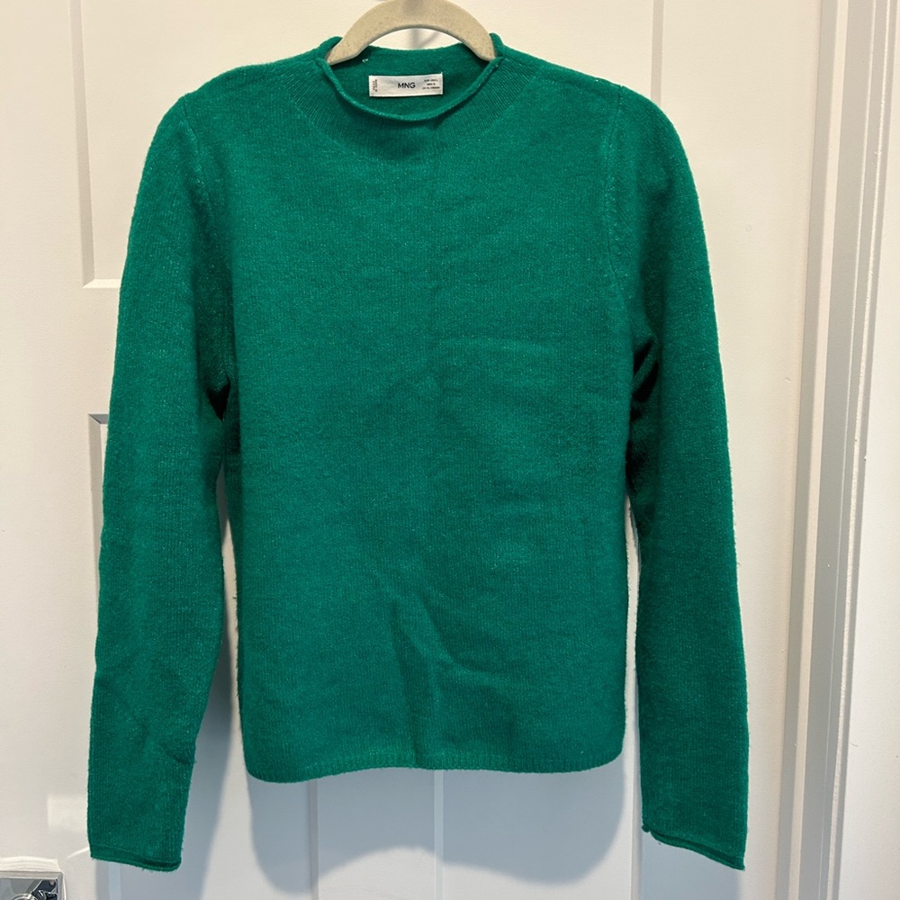 Green sweater.